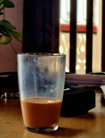 A steaming cup of strong milk tea.
